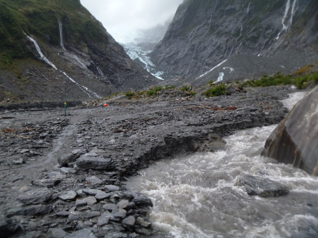 The toe of the Franz Josef glacier visible through the murk and the rain