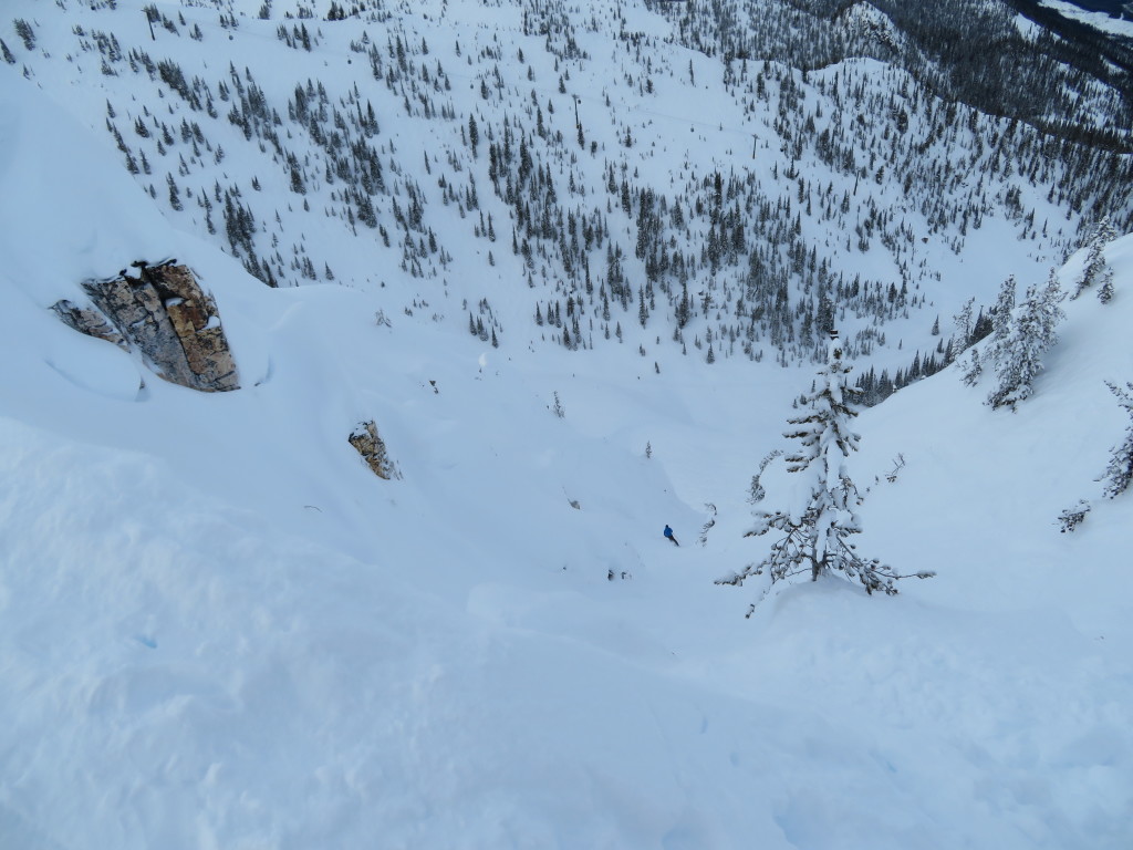 A skier descends 'Dare' chute on T1 north aspect.