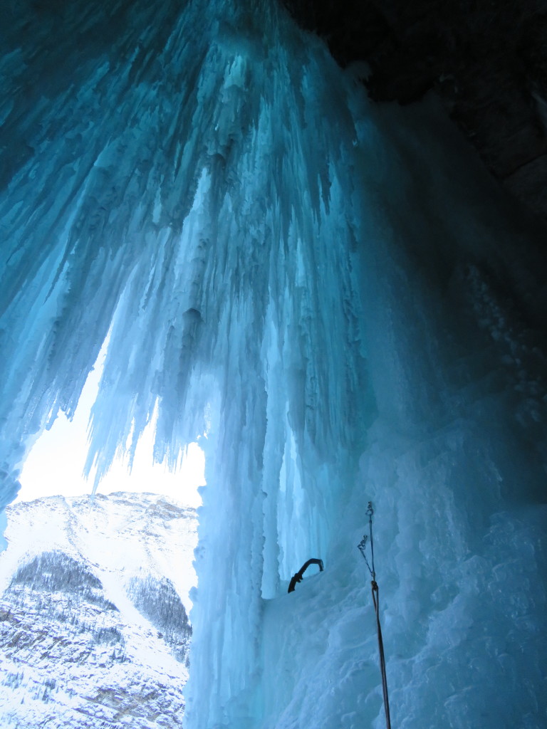 Reaching the top of the second pitch, and entering the stunning ice cave. The next pitch would involve climbing the left opposite side of the ice wall in this photo.